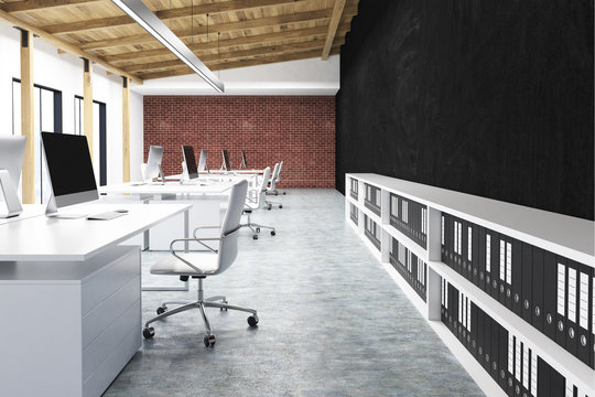 Side view of an office with a black wall