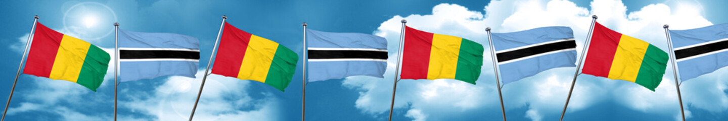 Guinea flag with Botswana flag, 3D rendering