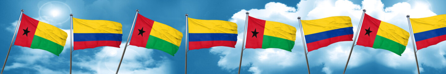 Guinea bissau flag with Colombia flag, 3D rendering