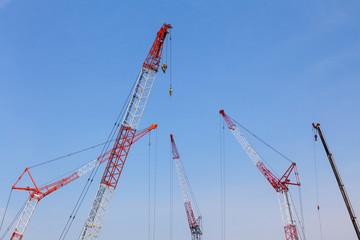 Close - up big red crane at construction site