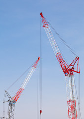 Close - up big red crane at construction site