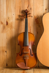 Fototapeta na wymiar violin and guitar on wood. background,still life