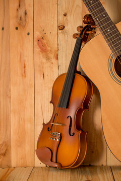 violin and guitar on wood. background,still life