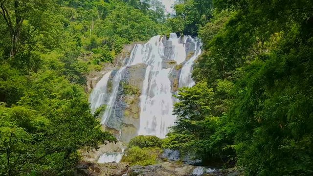 large powerful waterfall among green tropical jungle in Vietnam