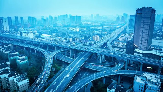 time lapse of city overpass with blue tone , expressway interchange and viaducts in hangzhou