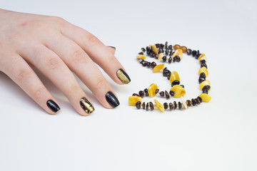 Beautiful natural nails, hand and ideal clean manicure. Decorated with stylish elements