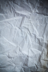 Obraz premium Recycled crumpled gray paper background dark edged.