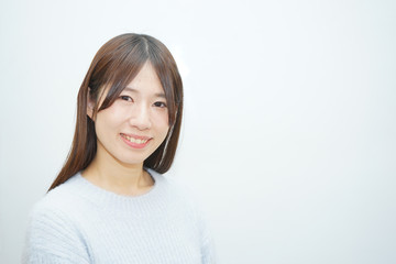 Fototapeta premium Young woman on the white background