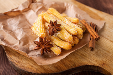 Spanish dessert: churros on the table. Selective focus. Copy space.