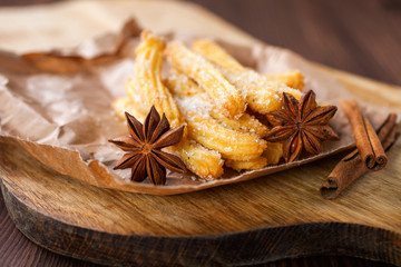 Spanish dessert: churros on the table. Selective focus. Copy space.