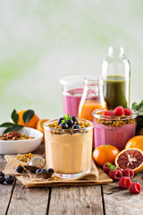 Orange mango smoothie with granola