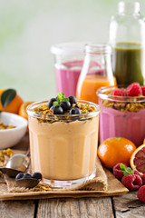 Orange mango smoothie with granola