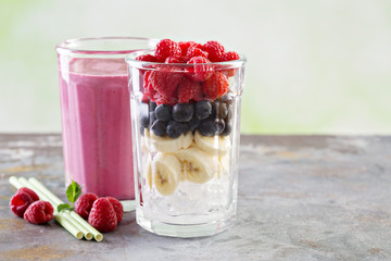 Berry smoothie ingredients in tall glass