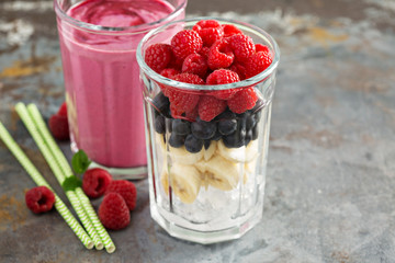 Berry smoothie ingredients in tall glass