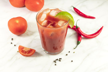 Bloody Mary cocktail with lime, chilis and copyspace