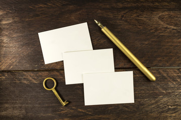 Thick cardboard business cards with ink pen and copyspace