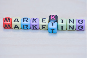 Market king Concept with dice on wooden background.