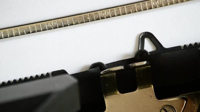 Typing the expression Part Five with an old manual typewriter