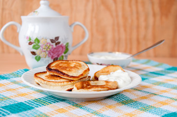 Delicious pancakes with sour cream for breakfast