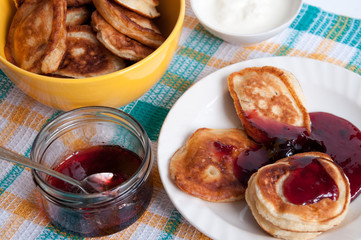 Delicious pancakes for breakfast with cherry jam