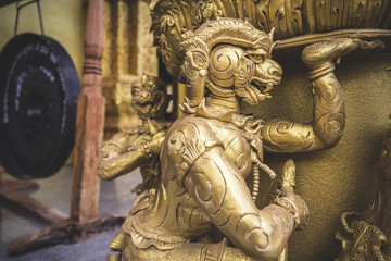 Wooden creatures ornamental carvings in buddhist golden temple