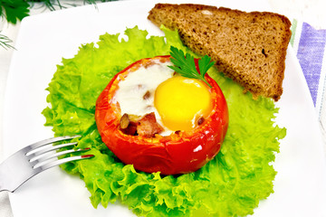 Scrambled eggs in tomato on board