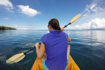 Young woman in a kayak Fiji