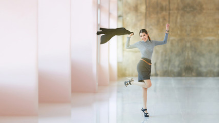 Business women : Asian women people young business women standing enjoy and jump, The beautiful model business woman hold suit and smiling, space brown wall background
