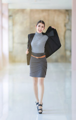 Asian people young businesswoman standing, The beautiful model business women hold suit and smiling