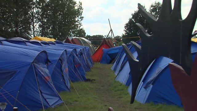blue shelter tents in the camp