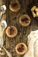 chocolate mousse with nuts in a glass jar