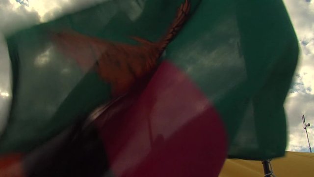 kenya's flag waving into the camp