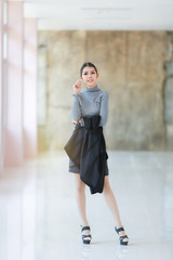 Asian people young businesswoman standing, The beautiful model business women hold suit and smiling - 135888043