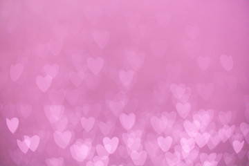 defocused lights bokeh background of pink hearts