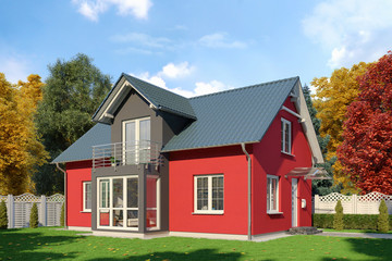Fototapeta na wymiar Ein rot-schwarzes Einfamilienhaus in blühender Natur im Herbst am Tag.