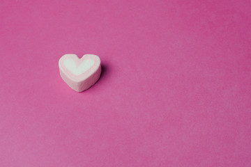 Pink heart shaped marshmallows background
