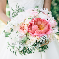 Beauty wedding bouquet in bride's hands
