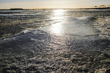 winter fishing on the sea the bright sun