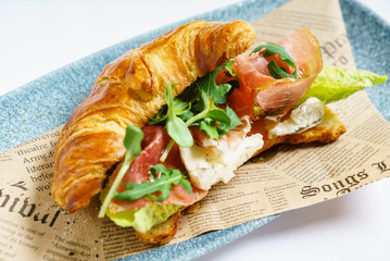 croissant sandwich with ham and cheese