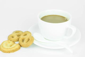 Coffee cup and candy on white background.