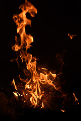 Burning fire background detail close up on black background.