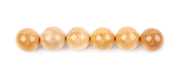 Line of six wooden spheres isolated