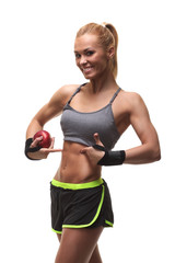 Fototapeta na wymiar young fitness woman happy smiling holding apple