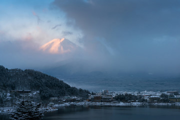Mountain Fuji and Kawaguchiko lake with morning mist in winter