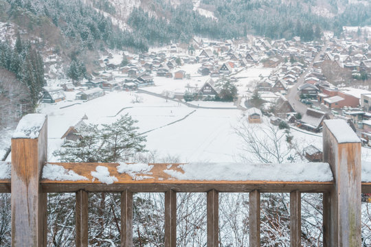Snow on wooden rail at Shirakawago view point, World Heritage Shirakawago in winter, Japan