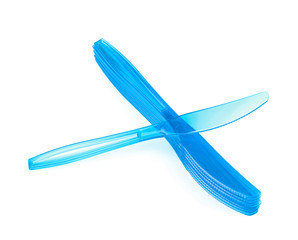 Pile of disposable knives isolated