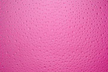 Water drops pink background. Water drops on glass background