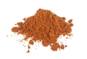 Pile of nutmeg powder isolated on white background