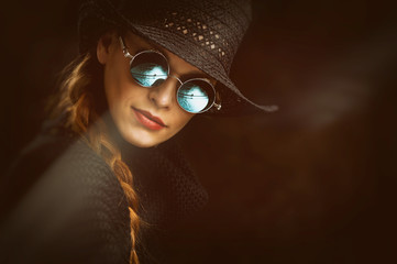 Young beauty woman in steampunk round glasses