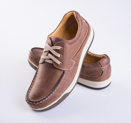shoe or brown color men's shoes on a background.